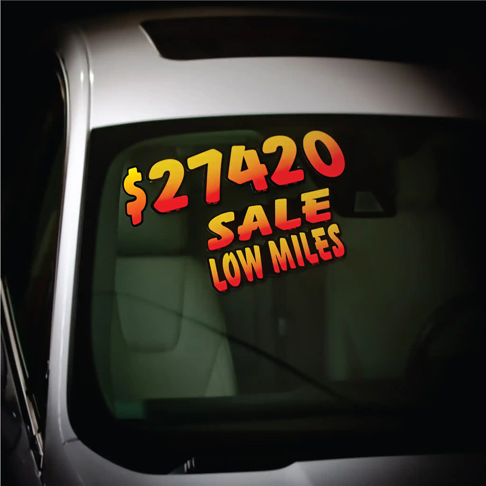 ORANGE AND BLACK DIECUT NUMBERS ON A CAR WINDSHIELD