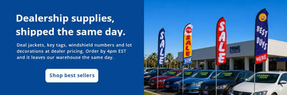 Front line of a car dealership, with Swooper Feather flags and windshield pricing numbers.