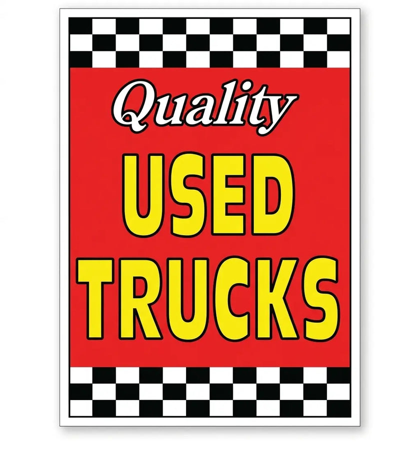 Sign with 'Quality Used Trucks' text on a red background with checkered border