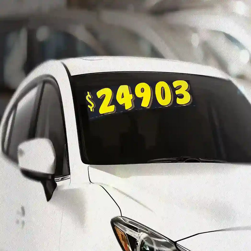 Yellow and Black Pricing numbers on a vehicle