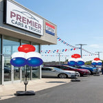 Thumbnail for Cars & Trucks dealership with cars on display and festive 
Reusable balloons outside.
