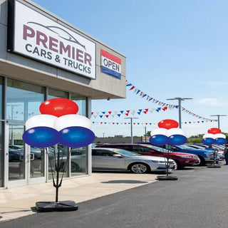 Cars & Trucks dealership with cars on display and festive 
Reusable balloons outside.