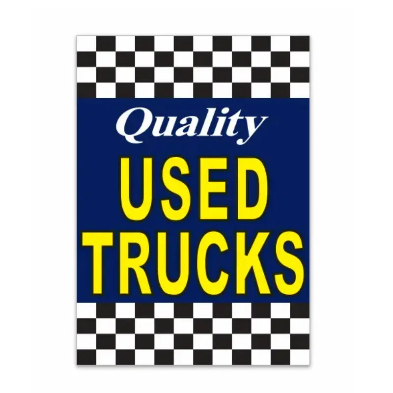 Sign with 'Quality Used Trucks' text on a checkered background